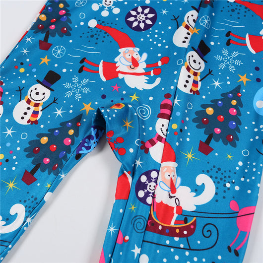 Family matching Christmas pajamas in blue with Santa, snowman, and tree print. Includes adult two-piece sets and a baby romper. - Image 15