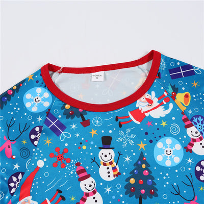 Family matching Christmas pajamas in blue with Santa, snowman, and tree print. Includes adult two-piece sets and a baby romper. - Image 16