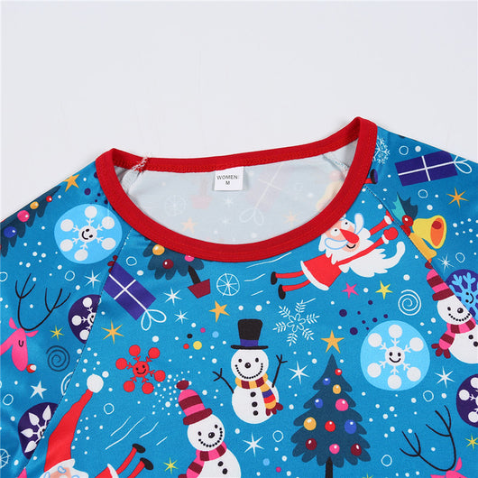 Family matching Christmas pajamas in blue with Santa, snowman, and tree print. Includes adult two-piece sets and a baby romper. - Image 16