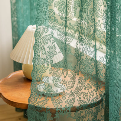 Close-up of a dark green lace curtain with an intricate floral and scrollwork pattern on sheer polyester fabric. - Image 9