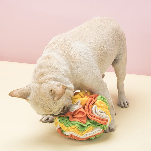 Pet sniffing pad in a ball shape, made of soft polar fleece in shades of pink, purple, and white, for dogs.