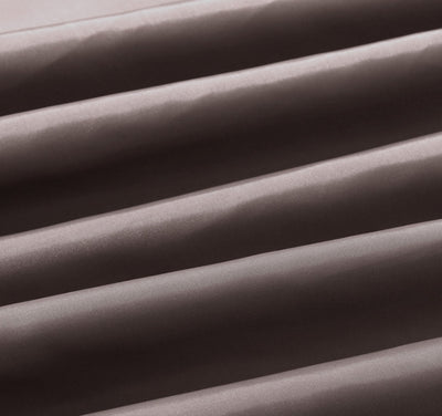 Solid brown polyester shower curtain with metal grommets and hooks, hanging from a silver shower rod. - Image 11