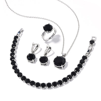 Four-piece jewelry set with silver-toned metal and round deep pink gemstones, including a necklace, bracelet, ring, and earrings. - Image 7