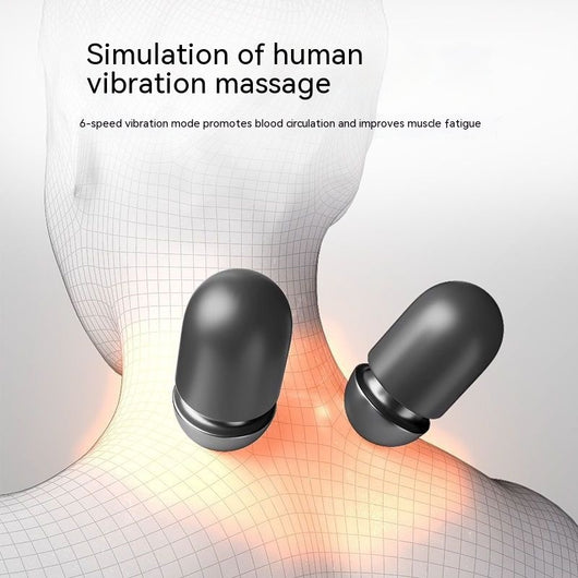 Dark gray cervical spine pillow with light gray textured massage area and power button on a light gray surface. - Image 10