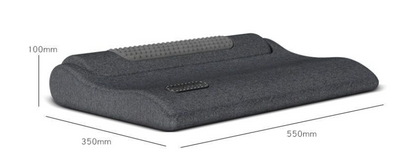 Dark gray cervical spine pillow with light gray textured massage area and power button on a light gray surface. - Image 14