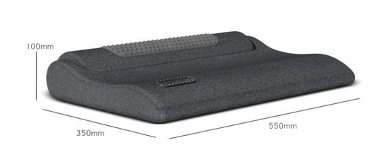 Dark gray cervical spine pillow with light gray textured massage area and power button on a light gray surface. - Image 14