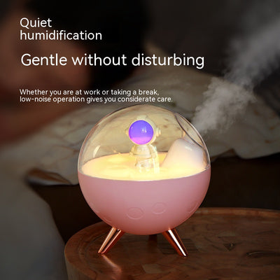 Space gray spaceman humidifier with a clear dome, glowing purple astronaut figurine, and warm yellow night light. - Image 9