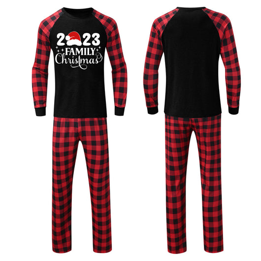Red and black buffalo plaid Christmas pajama set with a long-sleeve top and matching pants. Top reads "2023 FAMILY Christmas". - Image 21