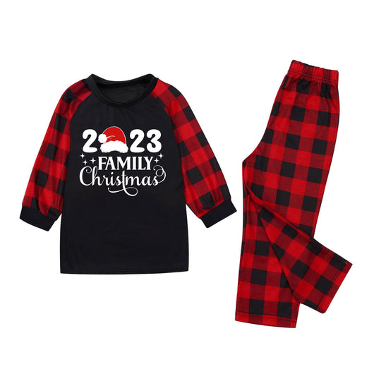 Red and black buffalo plaid Christmas pajama set with a long-sleeve top and matching pants. Top reads "2023 FAMILY Christmas". - Image 22