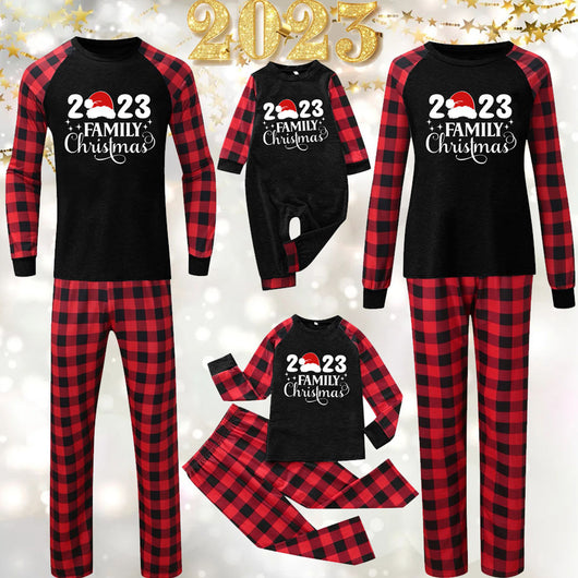 Red and black buffalo plaid Christmas pajama set with a long-sleeve top and matching pants. Top reads "2023 FAMILY Christmas". - Image 31