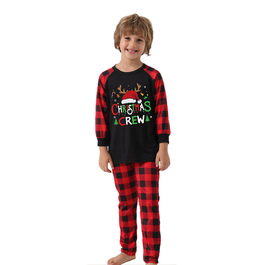 Man wearing a Christmas pajama set with a black long-sleeve top and red and black buffalo plaid pants. - Image 23