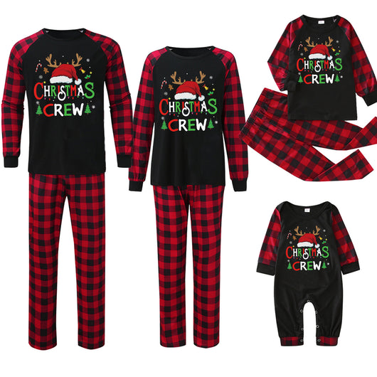 Man wearing a Christmas pajama set with a black long-sleeve top and red and black buffalo plaid pants. - Image 30