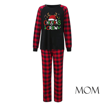 Man wearing a Christmas pajama set with a black long-sleeve top and red and black buffalo plaid pants. - Image 31