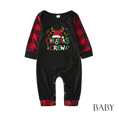 Man wearing a Christmas pajama set with a black long-sleeve top and red and black buffalo plaid pants. - Image 34