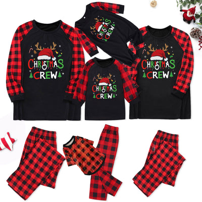 Man wearing a Christmas pajama set with a black long-sleeve top and red and black buffalo plaid pants. - Image 39