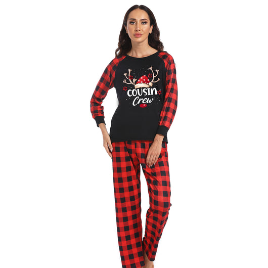 Kids' black and red buffalo plaid Christmas pajamas with 'Cousin Crew' graphic and reindeer antlers. - Image 17