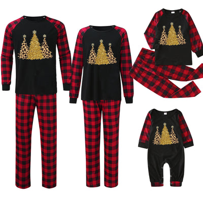Matching family Christmas pajamas with black tops, red and black plaid sleeves, and glittery leopard print Christmas trees. - Image 12