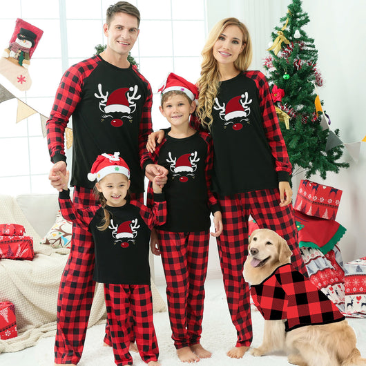 Matching family Christmas pajamas with black tops, red and black plaid sleeves, and glittery leopard print Christmas trees. - Image 13