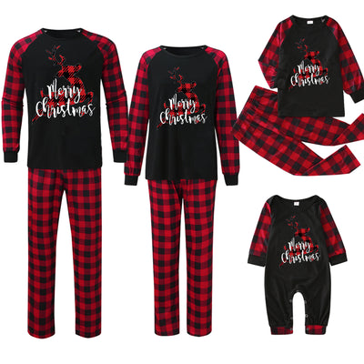 Matching family Christmas pajamas with black tops, red and black plaid sleeves, and glittery leopard print Christmas trees. - Image 17