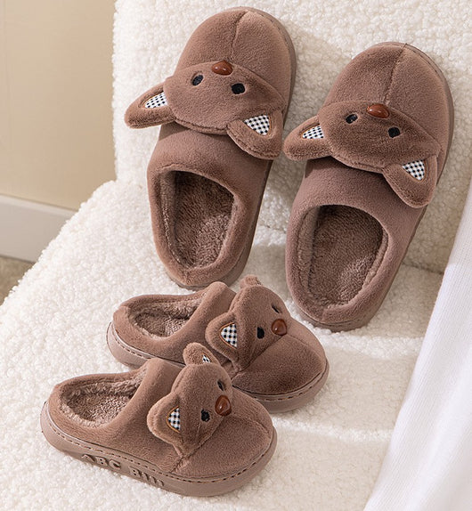 Pair of gray plush bear slippers with checkered ears and brown noses, held up against a soft background. - Image 11