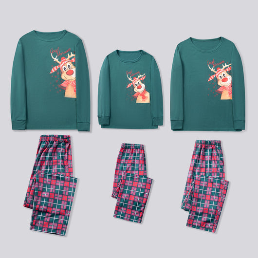 Family of five and a Boston Terrier wearing matching green long-sleeved Christmas pajamas with reindeer graphic and red plaid pants. - Image 15