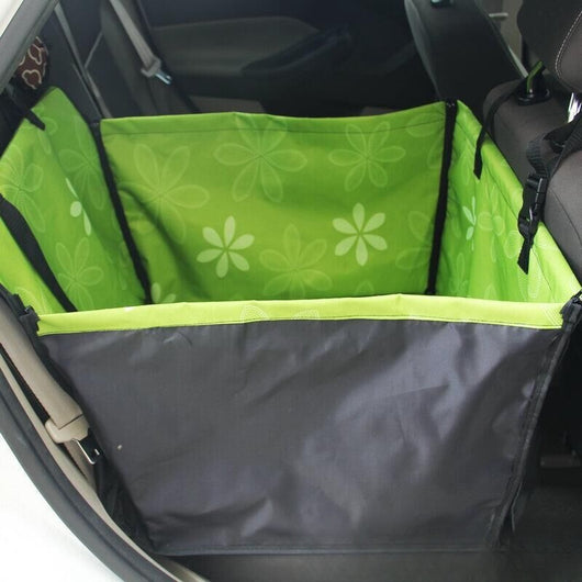 Brown pet car mat with colorful dog pattern installed in a car's rear seat, protecting upholstery. - Image 19