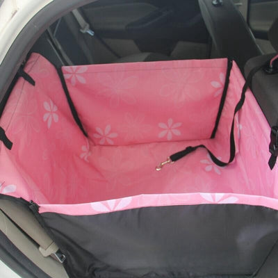 Brown pet car mat with colorful dog pattern installed in a car's rear seat, protecting upholstery. - Image 20