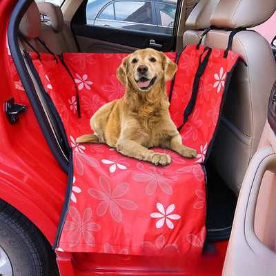 Brown pet car mat with colorful dog pattern installed in a car's rear seat, protecting upholstery. - Image 25