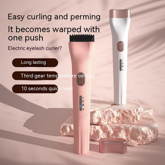 White portable heated eyelash curler with a rose gold power button and blue indicator light. - Image 8