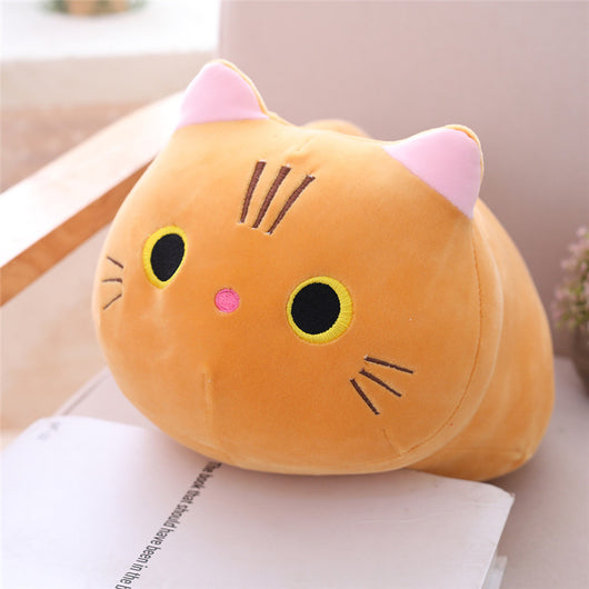 Cute orange cat plush doll with pink ears, black eyes, and embroidered whiskers, resting on a white book. - Image 15