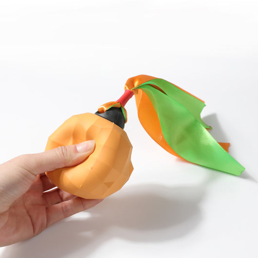 Lime green bell-shaped dog toy with a faceted, geometric surface for teeth cleaning. - Image 3
