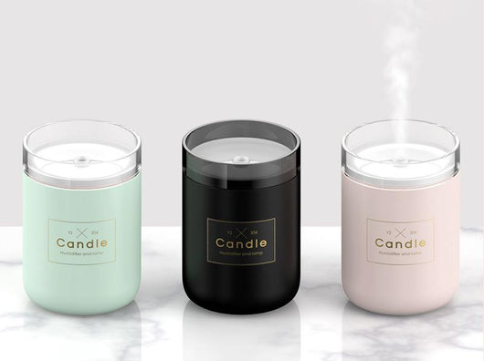 Light pink mini USB humidifier diffuser, shaped like a candle, with a clear top and visible mist output. - Image 10