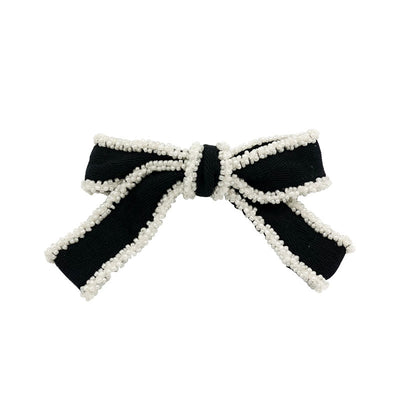 Diadema Elegante con Moño Blanco y Detalles Perlados - Image 5