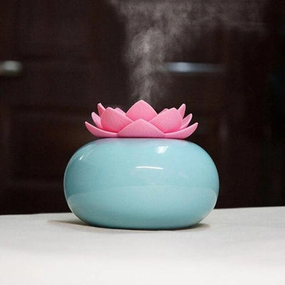 White ceramic lotus aromatherapy humidifier emitting a fine mist, perfect for home or office decor. - Image 6