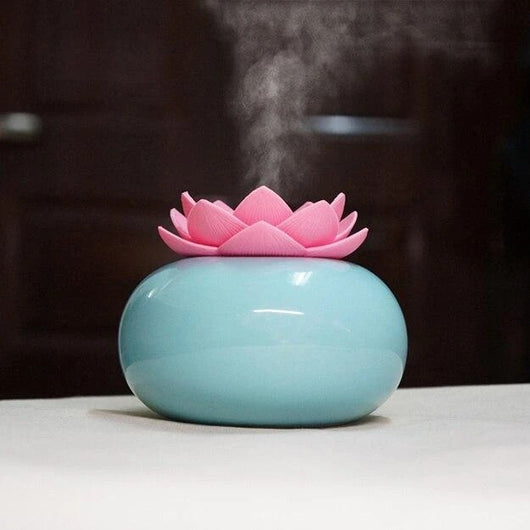White ceramic lotus aromatherapy humidifier emitting a fine mist, perfect for home or office decor. - Image 6