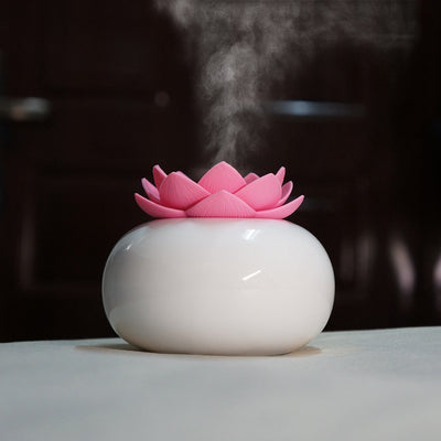 White ceramic lotus aromatherapy humidifier emitting a fine mist, perfect for home or office decor. - Image 8