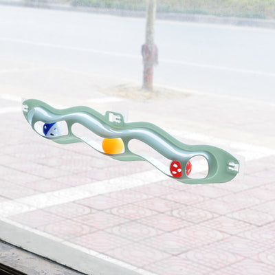 Light blue wavy pet track toy with red, yellow, and blue balls, shown with its packaging featuring two kittens. - Image 11