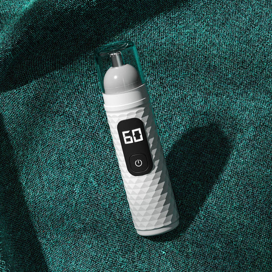 White electric nose hair trimmer with a textured body, clear cap, digital display, and power button. - Image 10