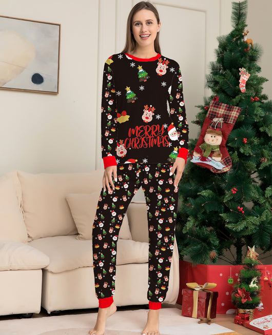 Man wearing a black long-sleeve Christmas pajama set with Santa, reindeer, and Christmas tree patterns. - Image 11