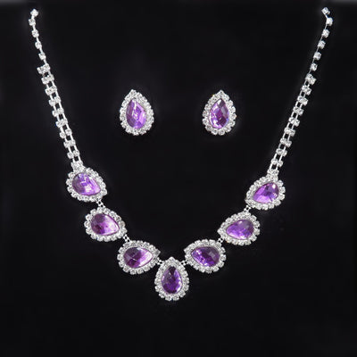 Purple teardrop rhinestone necklace and matching stud earrings set on a black background. - Image 15