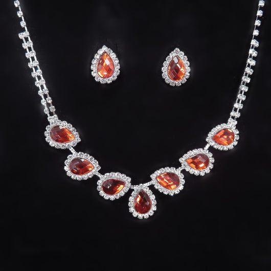 Purple teardrop rhinestone necklace and matching stud earrings set on a black background. - Image 19