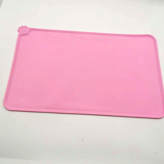 Blue rectangular silicone pet placemat with a raised edge and a small paw print detail in the corner. - Image 20
