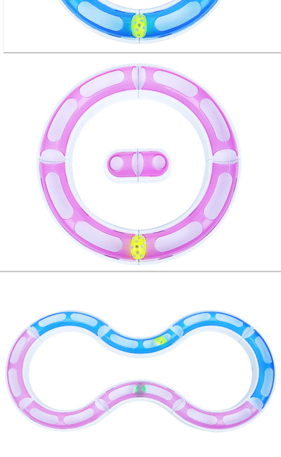 Pink and white circular cat track toy with an orange ball inside a smaller track for pet amusement. - Image 11