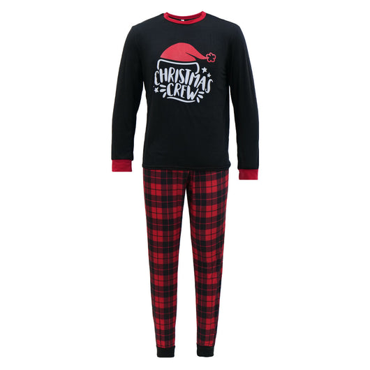 Family of four wearing matching red and black plaid Christmas pajamas with "Christmas CREW" graphic, children in Santa hats. - Image 10