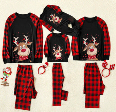 Christmas family pajamas with reindeer graphic on black tops, red and black plaid sleeves, and matching plaid pants. - Image 7