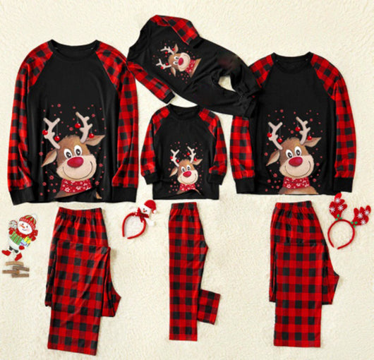 Christmas family pajamas with reindeer graphic on black tops, red and black plaid sleeves, and matching plaid pants. - Image 12