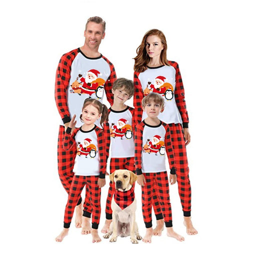 Christmas pajama set with a white long-sleeve top featuring Santa, reindeer, and penguin, and red and black plaid pants. - Image 29