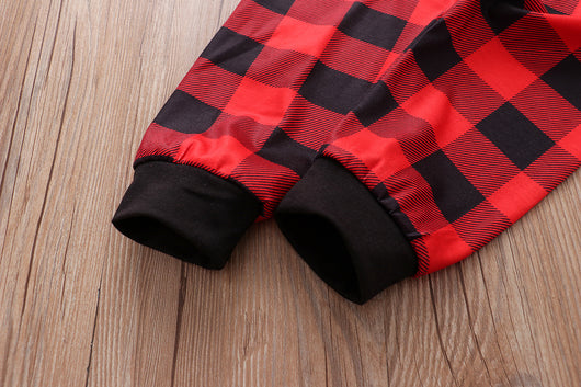 Christmas pajama set with a white long-sleeve top featuring Santa, reindeer, and penguin, and red and black plaid pants. - Image 31