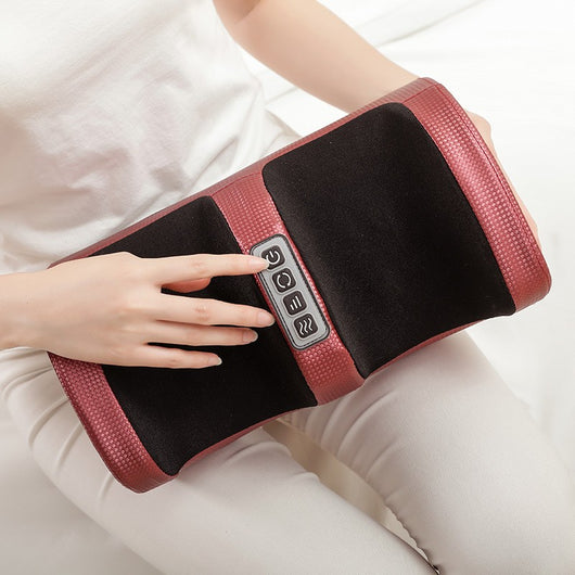 Person using a red and black electric foot massager with four control buttons for power, rotation, intensity, and heat. - Image 9