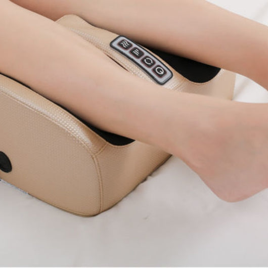 Person using a red and black electric foot massager with four control buttons for power, rotation, intensity, and heat. - Image 12